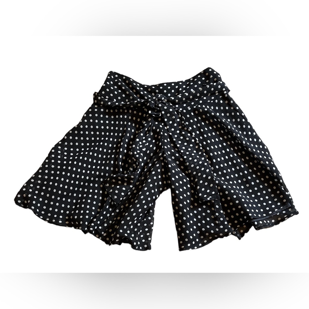 Black with white polka dots shorts flowing sheer material solid background